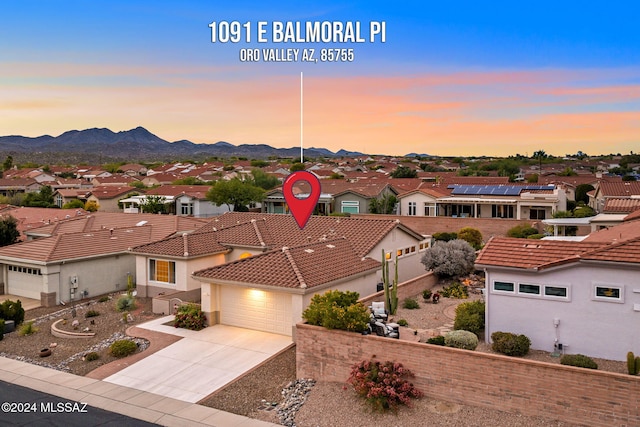 aerial view at dusk with a mountain view