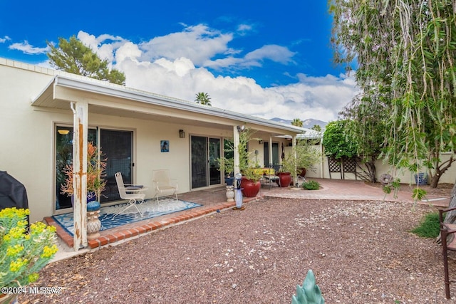 rear view of house with a patio