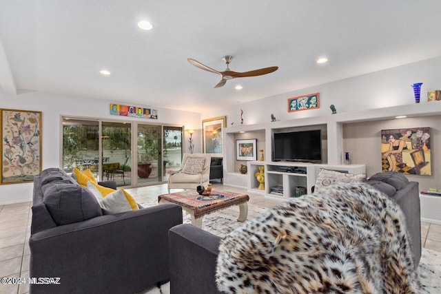 tiled living room featuring ceiling fan