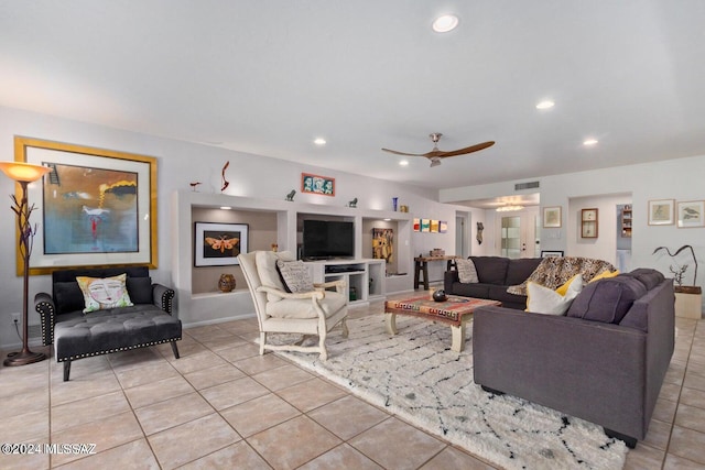 living room with light tile patterned flooring and ceiling fan