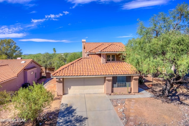 10081 N Pitchingwedge Ln, Tucson, AZ 85737 - mediterranean / spanish house with a tiled roof, stucco siding, driveway, and french doors