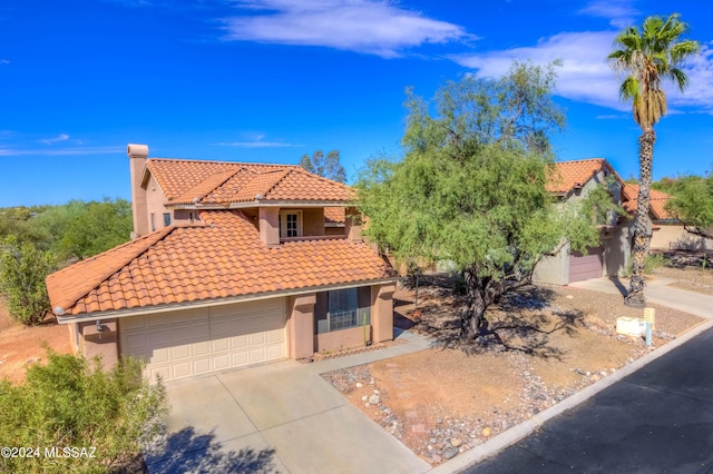 10081 N Pitchingwedge Ln, Tucson, AZ 85737 - mediterranean / spanish-style house featuring a tile roof, stucco siding, and concrete driveway