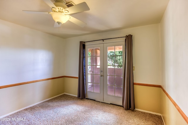 empty room with french doors, carpet floors, and ceiling fan