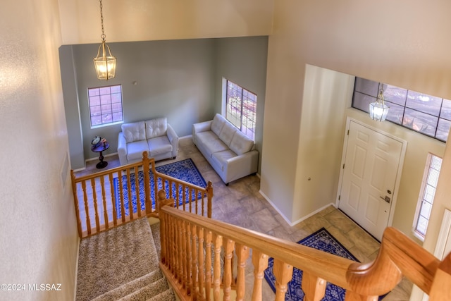 10081 N Pitchingwedge Ln, Tucson, AZ 85737 - foyer with healthy amount of natural light, baseboards, stairway, and a high ceiling