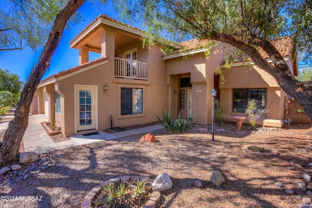 10081 N Pitchingwedge Ln, Tucson, AZ 85737 - back of property with a balcony, stucco siding, and a tile roof