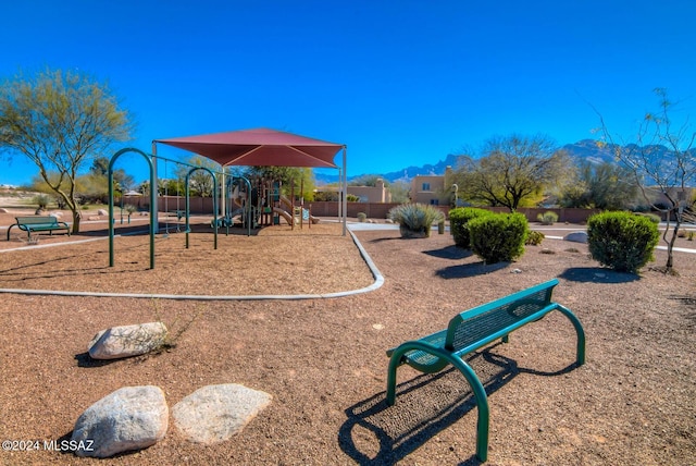 10081 N Pitchingwedge Ln, Tucson, AZ 85737 - community play area with a mountain view and fence