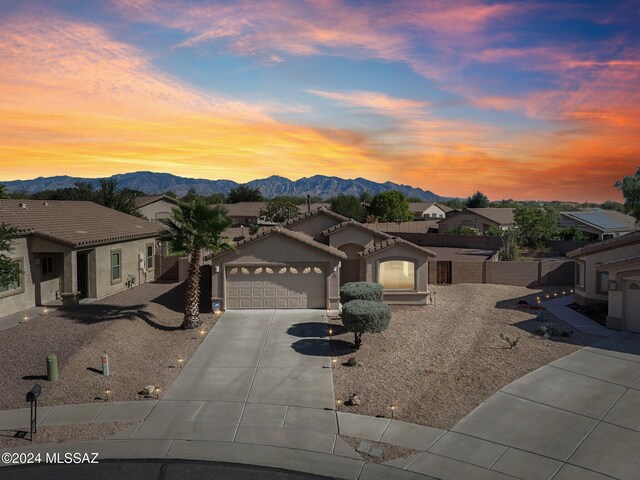 back house at dusk featuring a patio and a fenced in pool