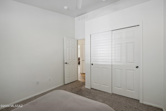 bedroom featuring a closet and carpet floors