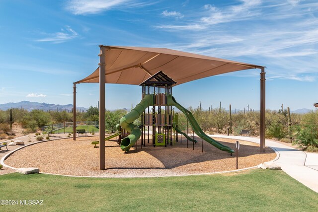 view of jungle gym with a mountain view