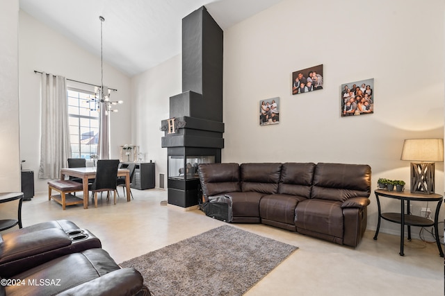 living room with an inviting chandelier and high vaulted ceiling