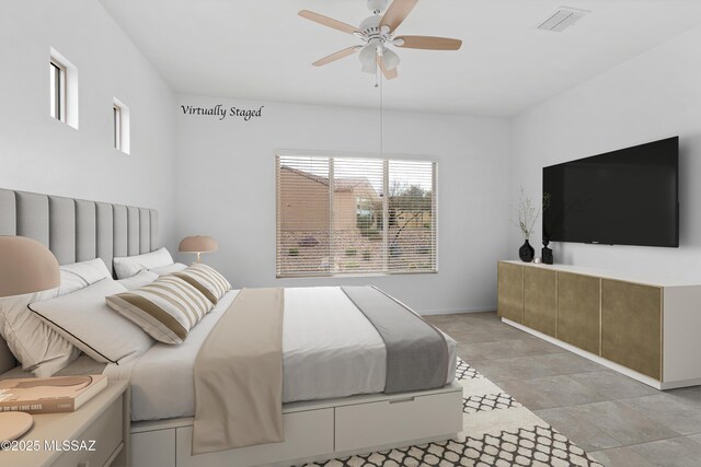 bedroom featuring baseboards, a ceiling fan, and visible vents