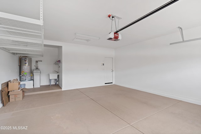 garage featuring water heater, a garage door opener, and a sink