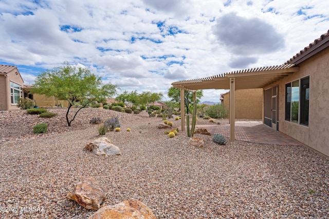 view of yard with a patio and a pergola