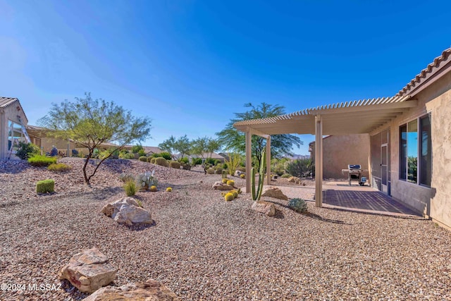 view of yard featuring a pergola and a patio