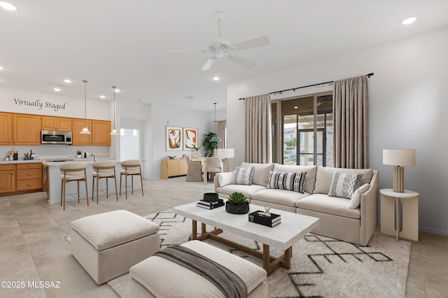 living room with recessed lighting, a ceiling fan, and light tile patterned floors