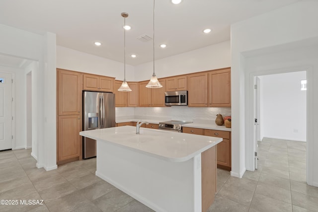 kitchen with stainless steel appliances, light countertops, tasteful backsplash, hanging light fixtures, and a center island with sink