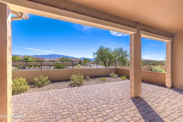 view of patio / terrace with a mountain view