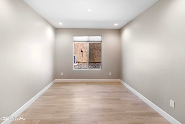 spare room with light wood-type flooring