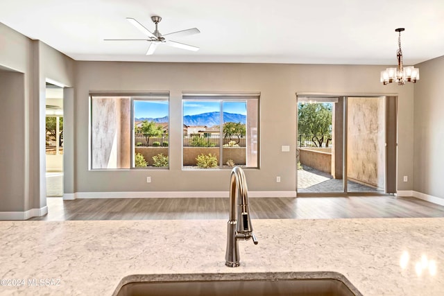 kitchen with hardwood / wood-style flooring, a healthy amount of sunlight, and sink