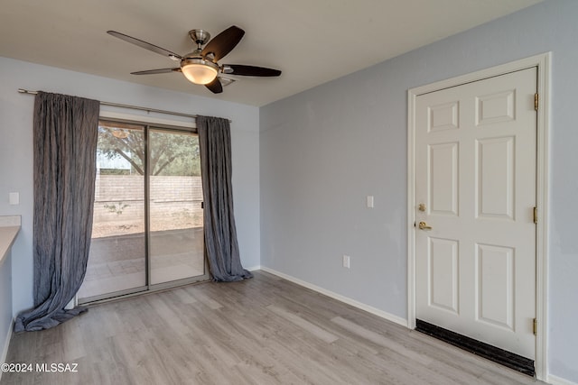 empty room featuring light hardwood / wood-style flooring and ceiling fan