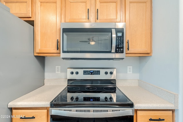 kitchen with appliances with stainless steel finishes and light brown cabinets