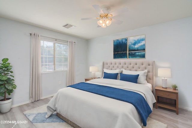 bedroom featuring light wood-type flooring and ceiling fan