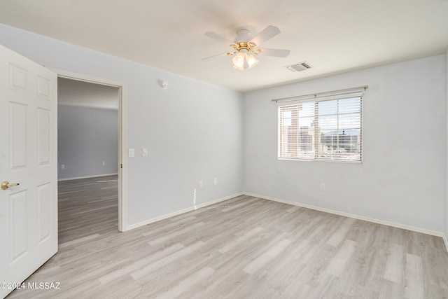 unfurnished room featuring light hardwood / wood-style flooring and ceiling fan