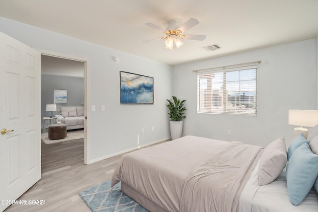 bedroom featuring light hardwood / wood-style flooring and ceiling fan