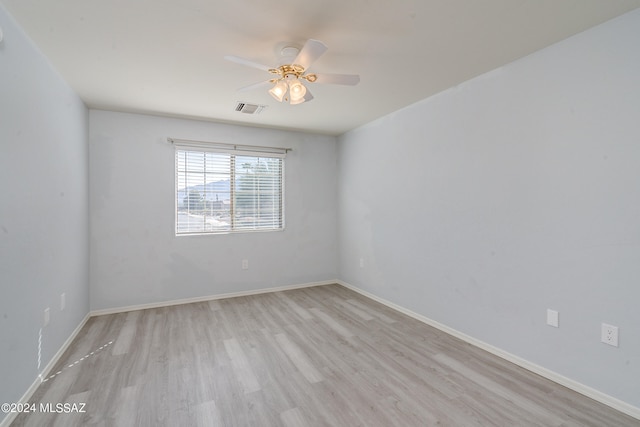 empty room with light wood-type flooring and ceiling fan