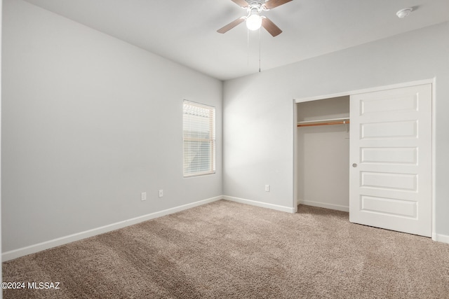 unfurnished bedroom featuring carpet, a closet, and ceiling fan