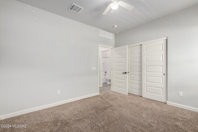 unfurnished bedroom featuring a closet, carpet flooring, and ceiling fan