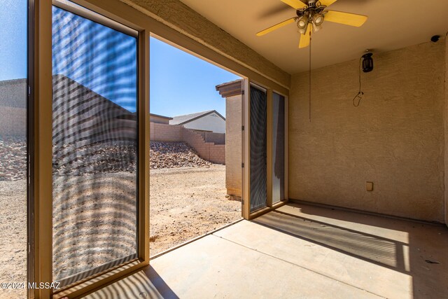 exterior space with ceiling fan