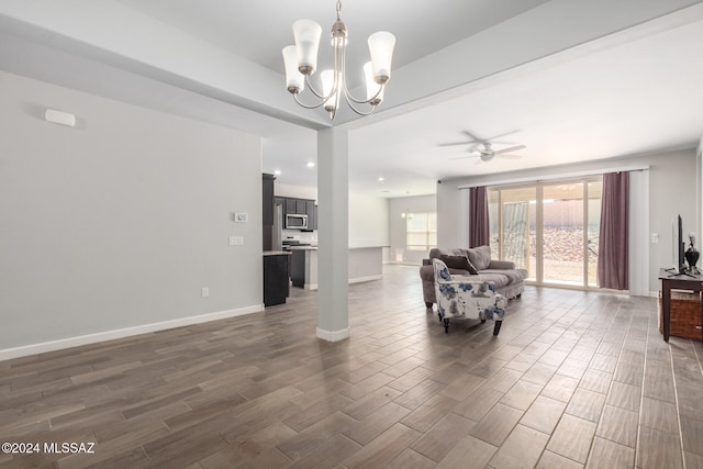 living room featuring dark hardwood / wood-style floors and ceiling fan with notable chandelier