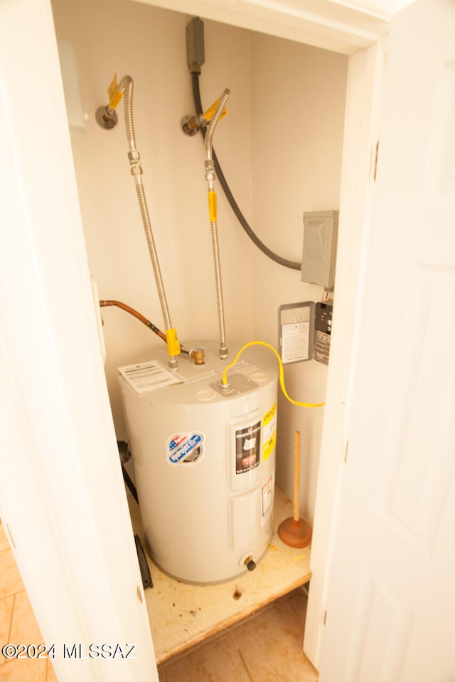 utility room with electric water heater