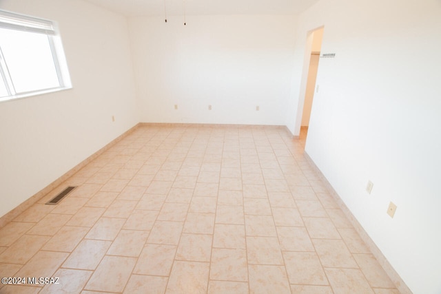 view of tiled spare room