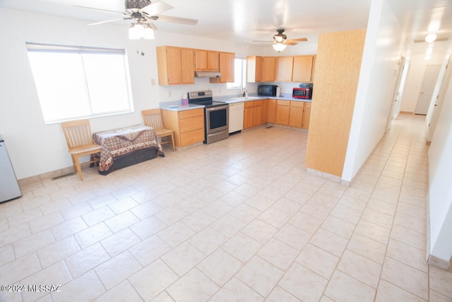 kitchen with electric stove, a healthy amount of sunlight, white dishwasher, and light brown cabinets