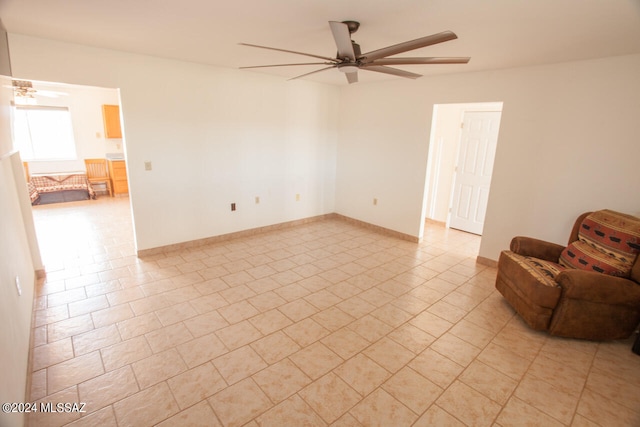 interior space featuring light tile patterned floors and ceiling fan