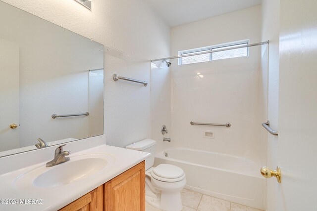 laundry area featuring washing machine and clothes dryer, light tile patterned floors, and cabinets