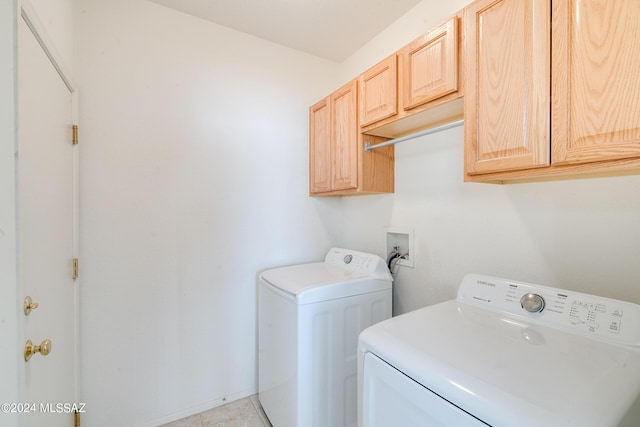 laundry room with cabinet space and washing machine and clothes dryer