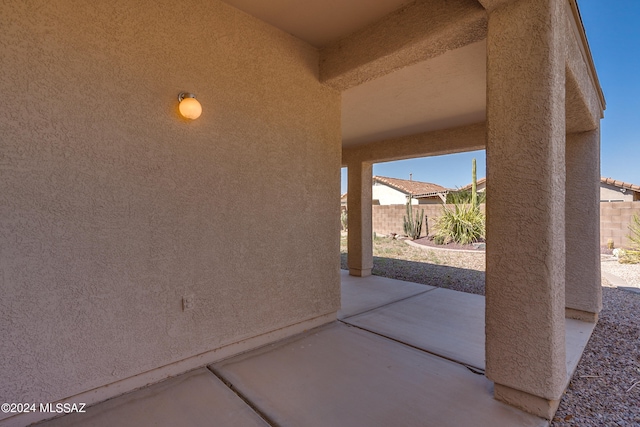 view of patio featuring fence