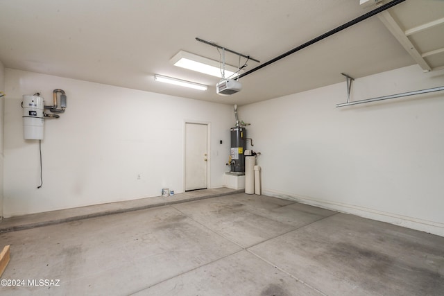 garage featuring water heater and a garage door opener