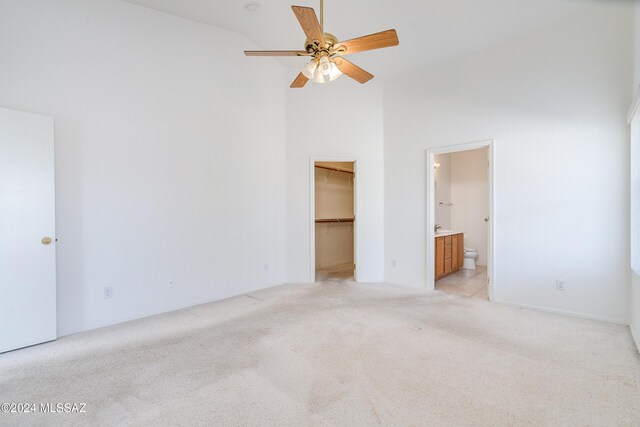 kitchen featuring light tile patterned flooring, ceiling fan, and white refrigerator