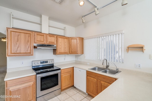 kitchen featuring sink, stainless steel range with electric cooktop, white dishwasher, rail lighting, and light tile patterned floors