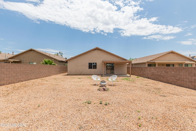 rear view of house with a patio