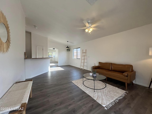 living room with dark hardwood / wood-style floors and ceiling fan