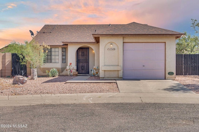 view of front of property with a garage