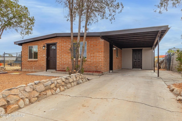 view of front of home with a carport