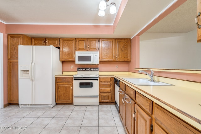 kitchen with sink, light tile patterned flooring, and white appliances