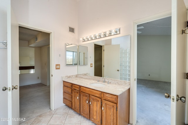 bathroom with vanity and tile patterned flooring