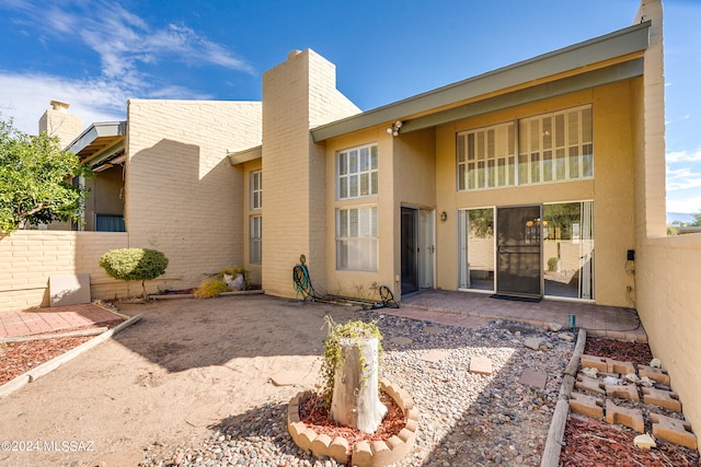 rear view of house featuring a patio area